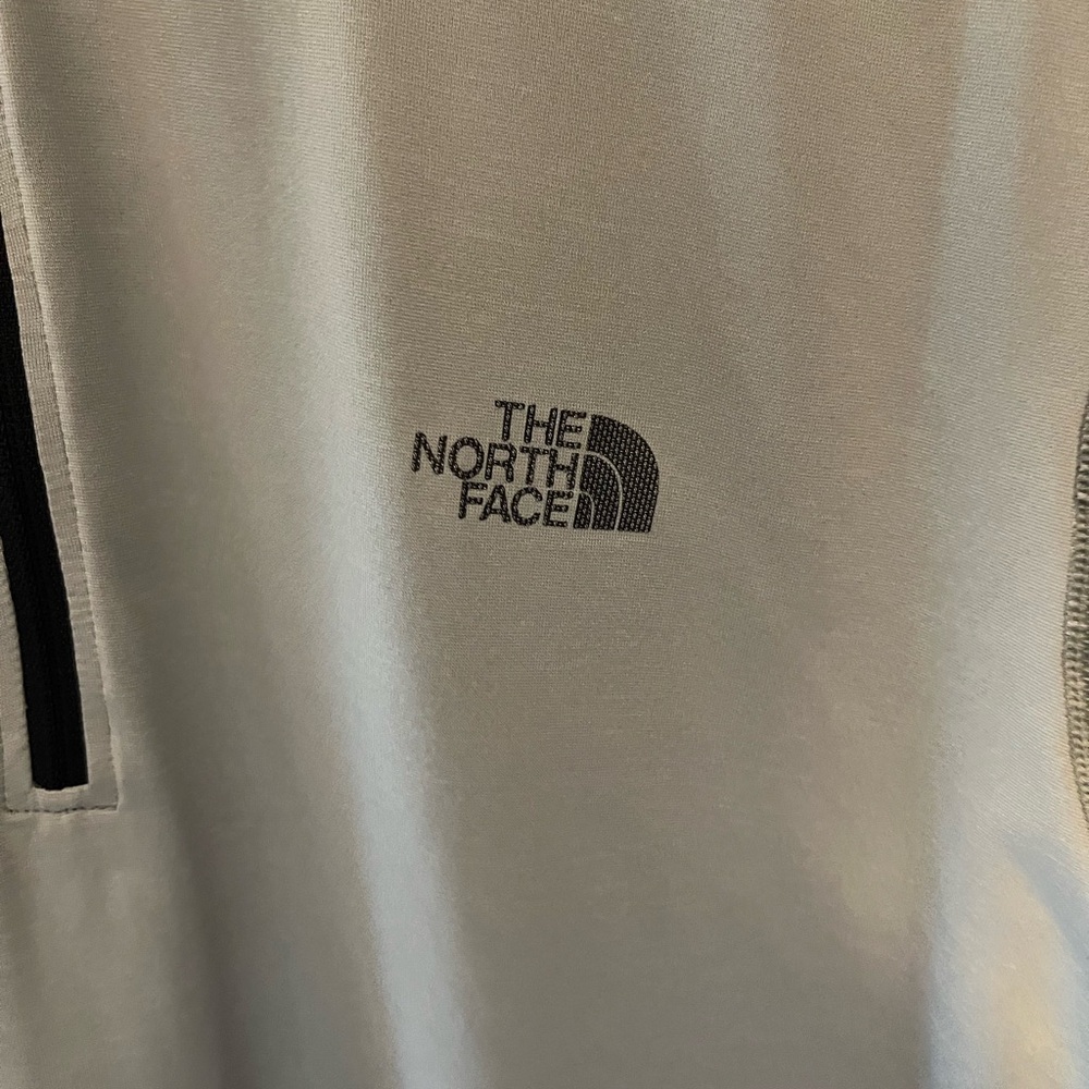 The North Face grey 1/4 zip. Excellent condition.